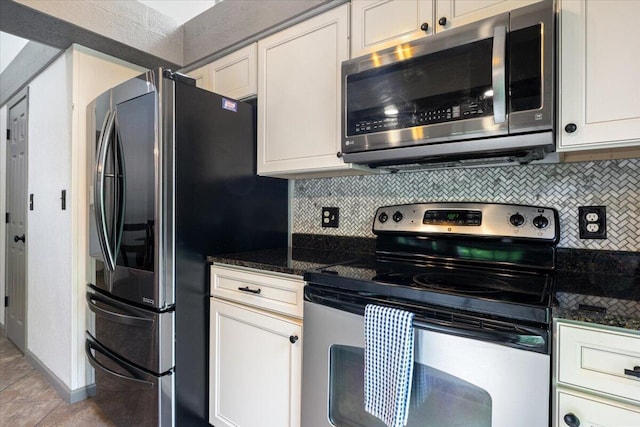 91 Moongate Dr, Osage Beach, MO 65065 - kitchen featuring appliances with stainless steel finishes, backsplash, white cabinets, and dark stone countertops