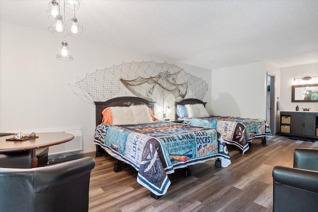 91 Moongate Dr, Osage Beach, MO 65065 - bedroom featuring wood finished floors and a textured ceiling