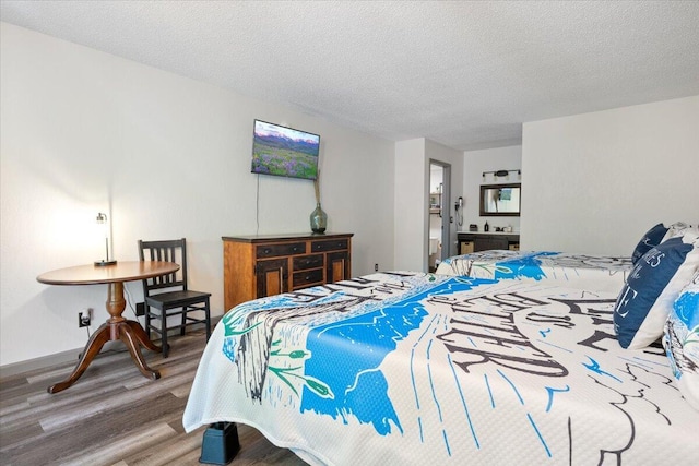91 Moongate Dr, Osage Beach, MO 65065 - bedroom featuring wood finished floors, a textured ceiling, and baseboards