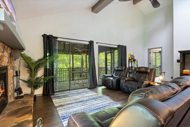 91 Moongate Dr, Osage Beach, MO 65065 - living room featuring ceiling fan, high vaulted ceiling, wood finished floors, beam ceiling, and a fireplace