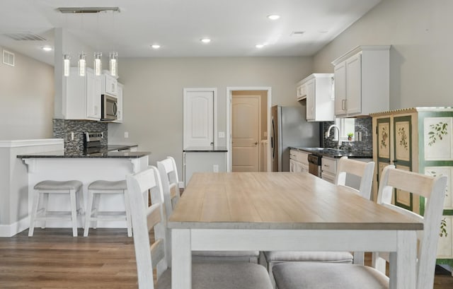 233 Siena Blvd, Branson, MO 65616 - dining room featuring dark wood-type flooring, recessed lighting, and baseboards