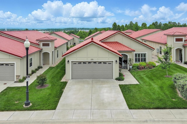 233 Siena Blvd, Branson, MO 65616 - mediterranean / spanish house featuring a tile roof, an attached garage, concrete driveway, board and batten siding, and a front lawn