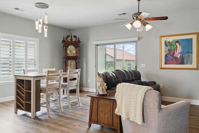233 Siena Blvd, Branson, MO 65616 - dining room featuring wood finished floors, a ceiling fan, healthy amount of natural light, and baseboards