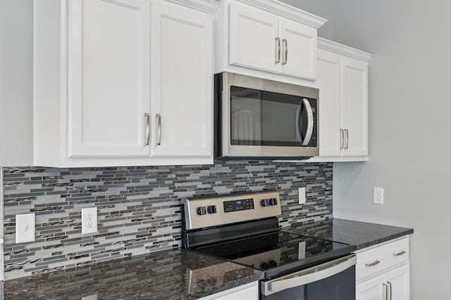 233 Siena Blvd, Branson, MO 65616 - kitchen featuring appliances with stainless steel finishes, decorative backsplash, and white cabinets