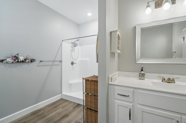 233 Siena Blvd, Branson, MO 65616 - bathroom with wood finished floors, a shower, baseboards, and vanity