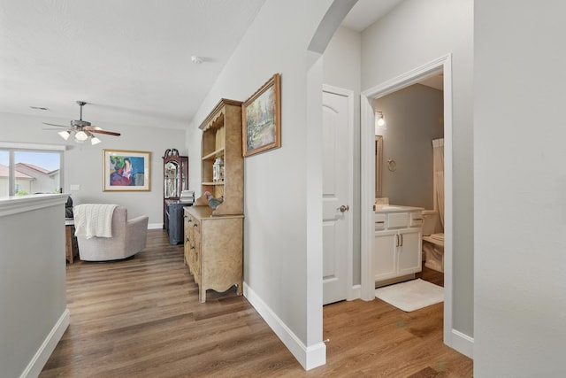 233 Siena Blvd, Branson, MO 65616 - hall with arched walkways, light wood-type flooring, and baseboards