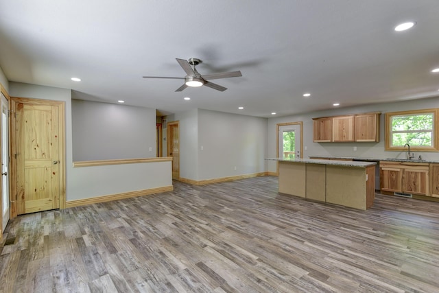 25173 Farm Rd Unit 1266, Shell Knob, MO 65747 - kitchen with a sink, wood finished floors, recessed lighting, a kitchen island, and baseboards