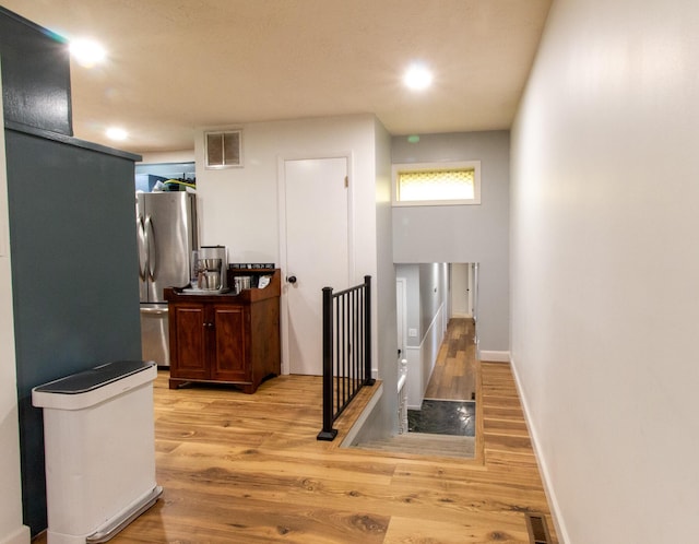 5312 S Hawthorne Dr, Springfield, MO 65804 - hallway with wood finished floors, baseboards, an upstairs landing, and recessed lighting