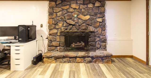 5312 S Hawthorne Dr, Springfield, MO 65804 - detailed view of wood finished floors, an office area, baseboards, and a stone fireplace