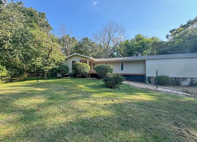 5312 S Hawthorne Dr, Springfield, MO 65804 - view of home's exterior with a lawn