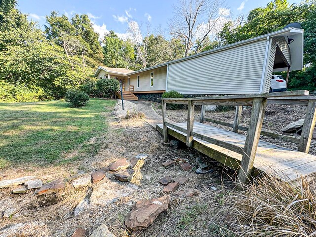5312 S Hawthorne Dr, Springfield, MO 65804 - view of property exterior with a yard