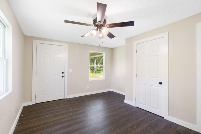 1827 N Tyler Ave, Springfield, MO 65802 - foyer featuring dark wood-style floors, ceiling fan, and baseboards