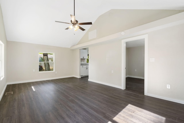1827 N Tyler Ave, Springfield, MO 65802 - unfurnished living room with ceiling fan, dark wood finished floors, baseboards, and high vaulted ceiling