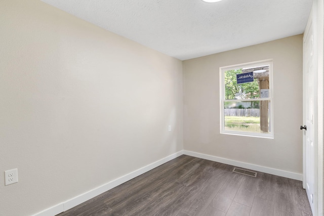 1827 N Tyler Ave, Springfield, MO 65802 - unfurnished room with dark wood-style floors and baseboards
