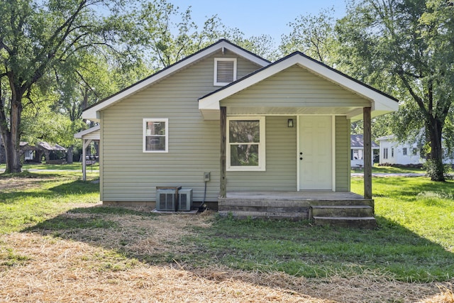 1827 N Tyler Ave, Springfield, MO 65802 - rear view of property with a porch, central air condition unit, and a yard