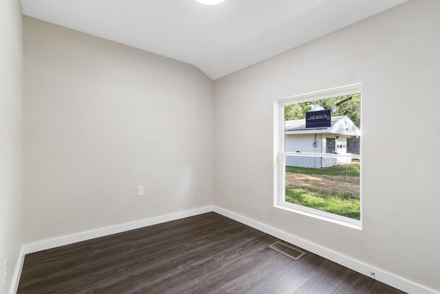 1827 N Tyler Ave, Springfield, MO 65802 - empty room with dark wood-type flooring, baseboards, and lofted ceiling