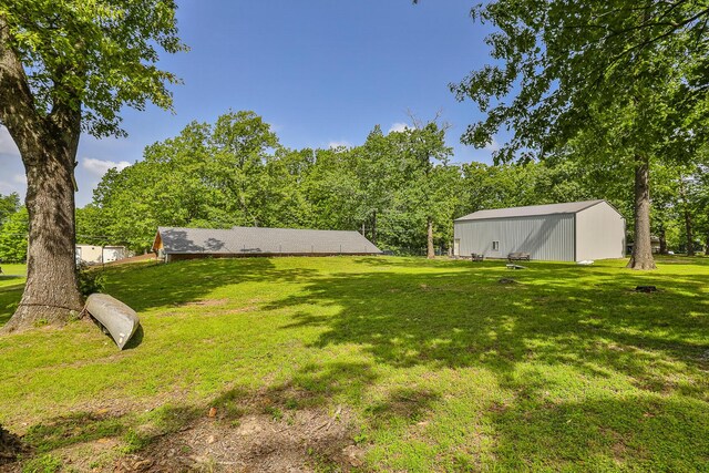 296 Lodgepole Dr, Ozark, MO 65721 - view of grassy yard featuring an outbuilding and an outdoor structure