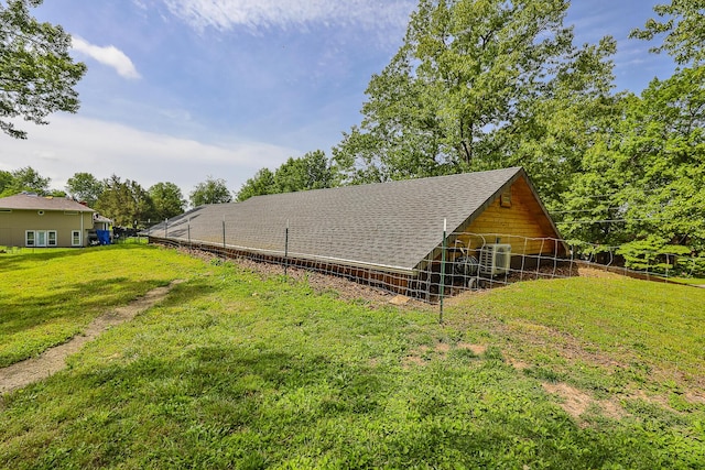 296 Lodgepole Dr, Ozark, MO 65721 - view of property exterior with an outdoor structure, roof with shingles, an exterior structure, and central air condition unit