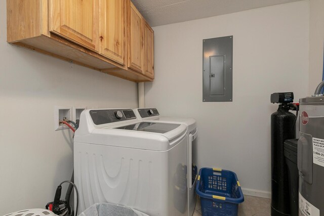 296 Lodgepole Dr, Ozark, MO 65721 - clothes washing area featuring electric panel, cabinet space, washer and clothes dryer, tile patterned floors, and baseboards