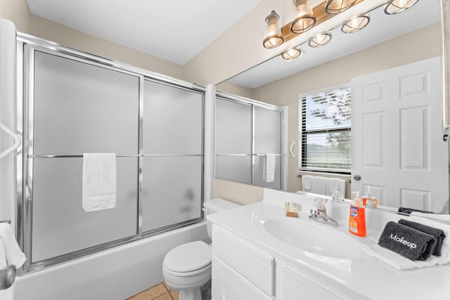 13 Treehouse Ln Unit 4, Branson, MO 65616 - full bathroom featuring bath / shower combo with glass door, vanity, toilet, and tile patterned floors