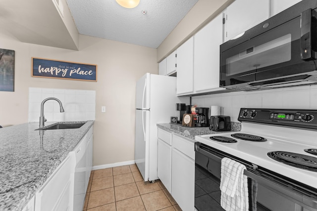 13 Treehouse Ln Unit 4, Branson, MO 65616 - kitchen with electric range, black microwave, a sink, white cabinetry, and a textured ceiling