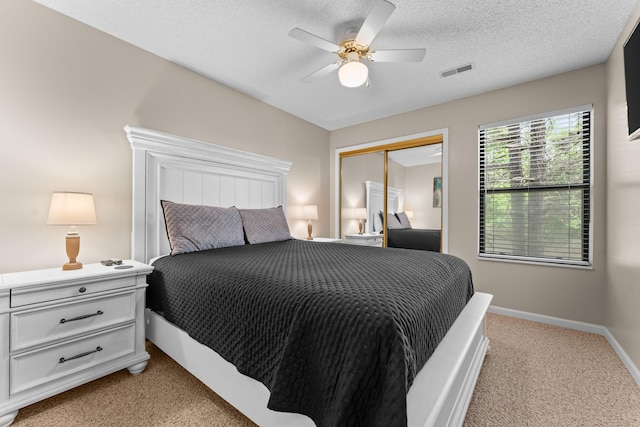 13 Treehouse Ln Unit 4, Branson, MO 65616 - bedroom featuring light carpet, a closet, ceiling fan, baseboards, and a textured ceiling