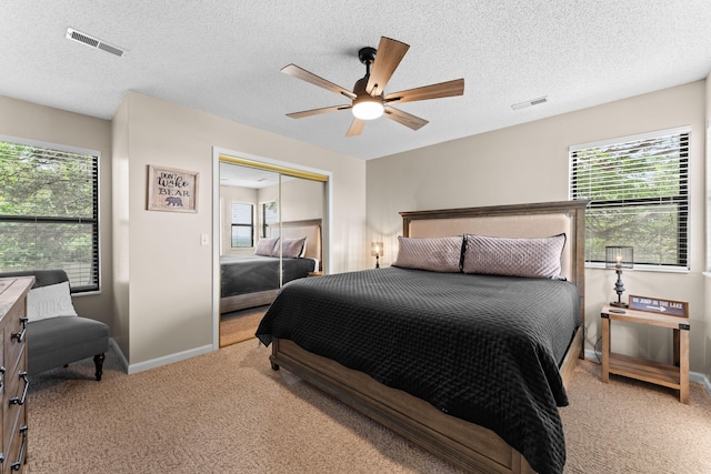 13 Treehouse Ln Unit 4, Branson, MO 65616 - carpeted bedroom with a closet, baseboards, a ceiling fan, and a textured ceiling