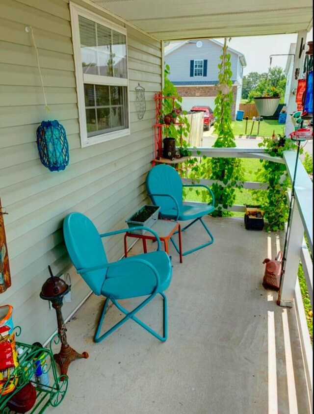 1810 Meadows Dr, Neosho, MO 64850 - view of patio / terrace with covered porch