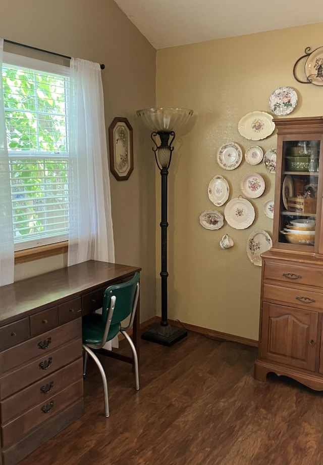 1810 Meadows Dr, Neosho, MO 64850 - office with dark wood-type flooring, vaulted ceiling, and baseboards