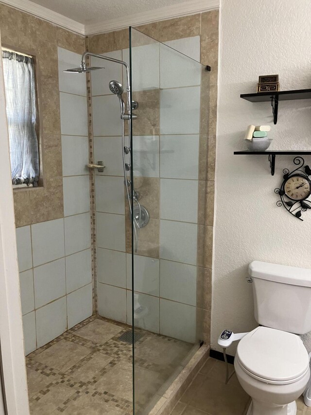 1810 Meadows Dr, Neosho, MO 64850 - bathroom with crown molding, a shower stall, and toilet