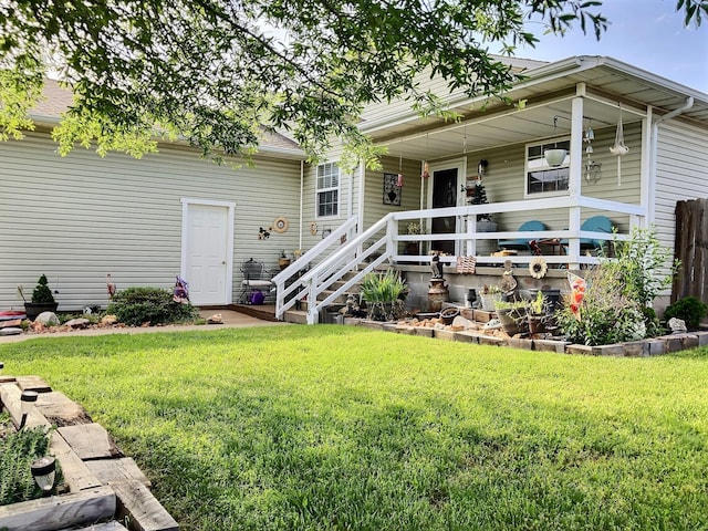 1810 Meadows Dr, Neosho, MO 64850 - back of property with a lawn and a porch