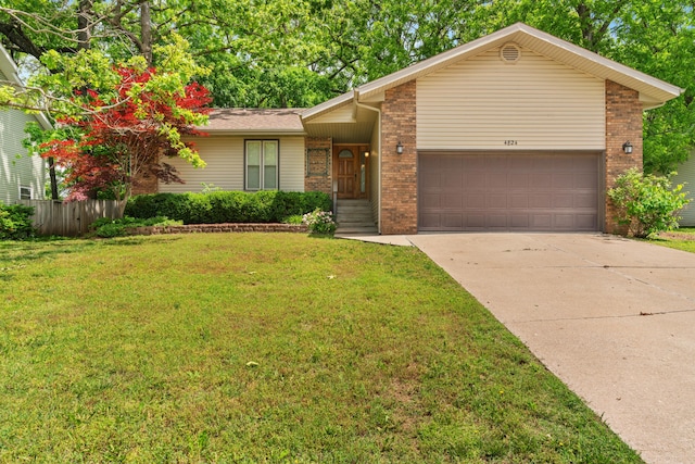4824 S Gold Rd, Battlefield, MO 65619 - view of front facade featuring brick siding, an attached garage, and concrete driveway