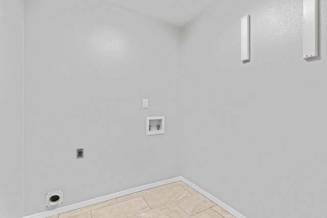 4824 S Gold Rd, Battlefield, MO 65619 - clothes washing area with electric dryer hookup, washer hookup, baseboards, and light tile patterned flooring