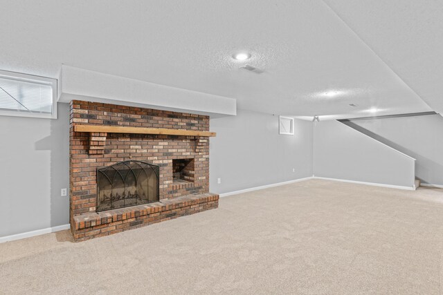 4824 S Gold Rd, Battlefield, MO 65619 - unfurnished living room featuring a textured ceiling, carpet floors, a fireplace, baseboards, and recessed lighting