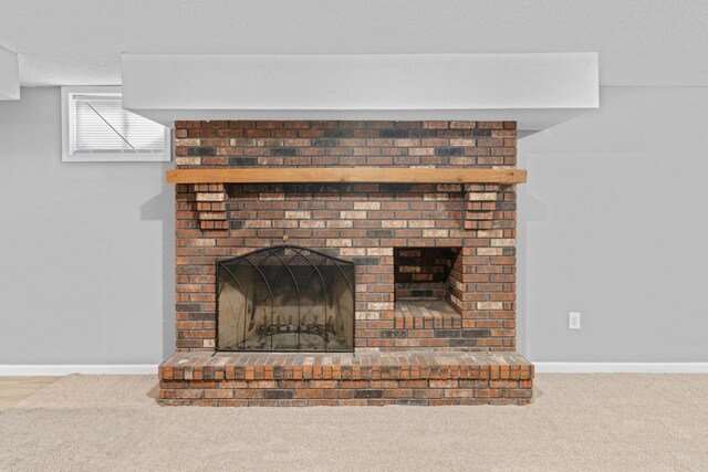 4824 S Gold Rd, Battlefield, MO 65619 - detailed view of a brick fireplace, carpet, and baseboards