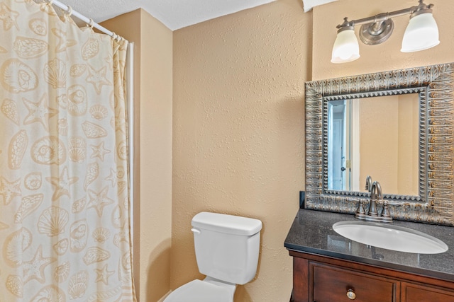 4824 S Gold Rd, Battlefield, MO 65619 - bathroom featuring toilet, vanity, a textured wall, and curtained shower