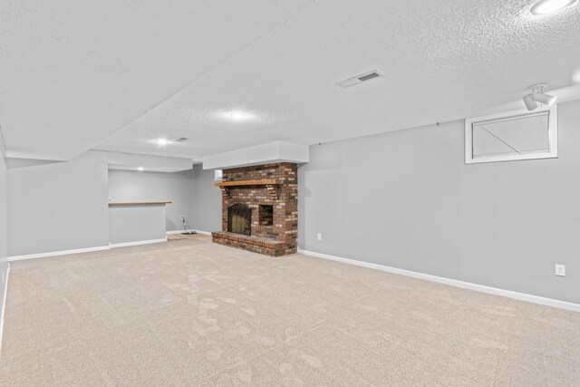 4824 S Gold Rd, Battlefield, MO 65619 - unfurnished living room with a textured ceiling, a fireplace, carpet, recessed lighting, and baseboards