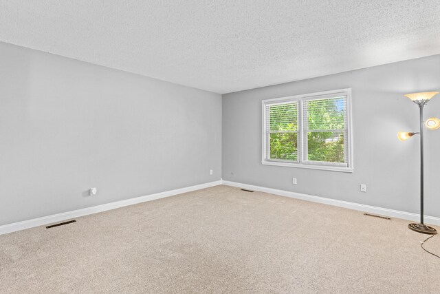 4824 S Gold Rd, Battlefield, MO 65619 - unfurnished room with a textured ceiling, carpet floors, and baseboards
