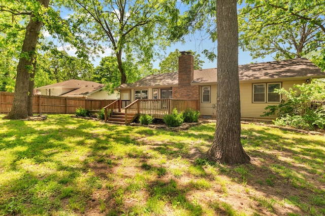 4824 S Gold Rd, Battlefield, MO 65619 - rear view of house featuring a chimney and a wooden deck