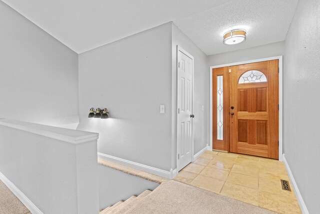 4824 S Gold Rd, Battlefield, MO 65619 - tiled entrance foyer with baseboards and a textured ceiling