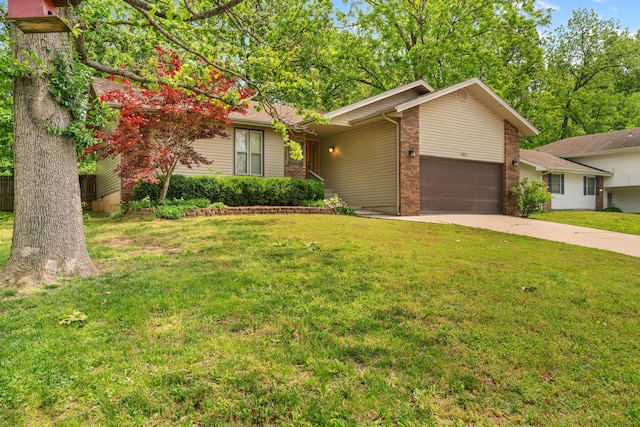 4824 S Gold Rd, Battlefield, MO 65619 - view of front of property with an attached garage, driveway, a front lawn, and brick siding