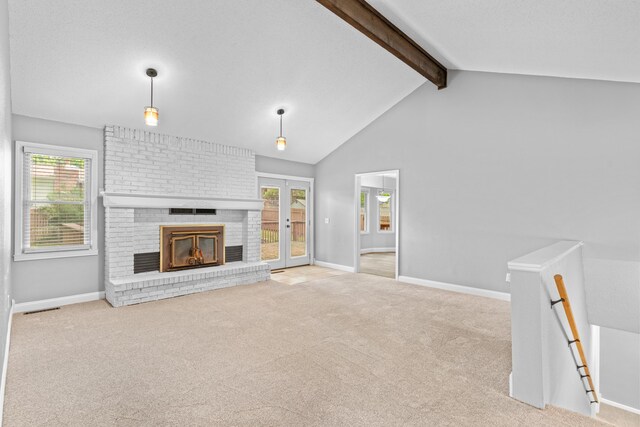 4824 S Gold Rd, Battlefield, MO 65619 - unfurnished living room with carpet flooring, beamed ceiling, baseboards, french doors, and a brick fireplace