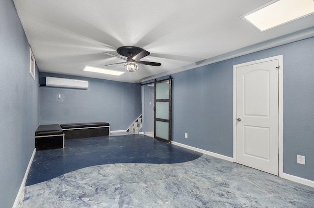 2418 E Catalpa St, Springfield, MO 65804 - empty room with a barn door, concrete flooring, a wall unit AC, and baseboards