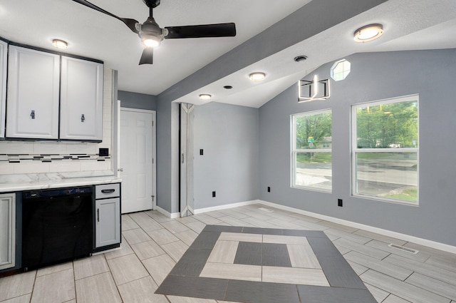 2418 E Catalpa St, Springfield, MO 65804 - kitchen with dishwasher, lofted ceiling, a ceiling fan, decorative backsplash, and baseboards