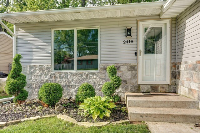 2418 E Catalpa St, Springfield, MO 65804 - doorway to property with stone siding