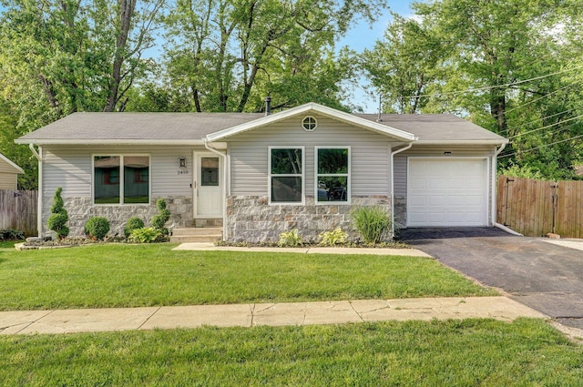 2418 E Catalpa St, Springfield, MO 65804 - single story home featuring an attached garage, driveway, and stone siding