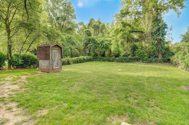 2418 E Catalpa St, Springfield, MO 65804 - view of yard with a storage shed and an outdoor structure