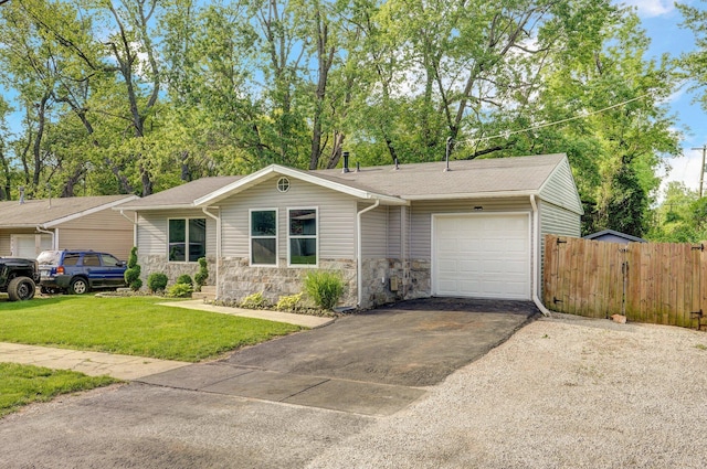 2418 E Catalpa St, Springfield, MO 65804 - single story home with a garage, asphalt driveway, and stone siding