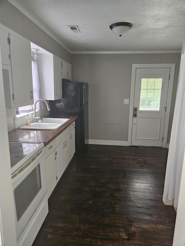 1629 W Webster St, Springfield, MO 65802 - kitchen with white range with electric cooktop, a sink, dark wood-style flooring, white cabinetry, and ornamental molding