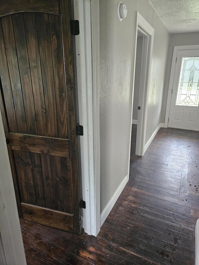 1629 W Webster St, Springfield, MO 65802 - foyer with wood-type flooring, baseboards, and a textured ceiling
